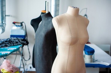 Interior of garment factory . Closes making atelier with several sewing machines. Tailoring industry, fashion designer workshop, industry concept