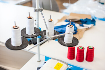 Interior of garment factory . Closes making atelier with several sewing machines. Tailoring industry, fashion designer workshop, industry concept