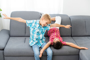 boy and girl, brother and sister at home