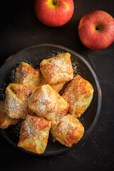 Homemade small apple turnovers in bowl