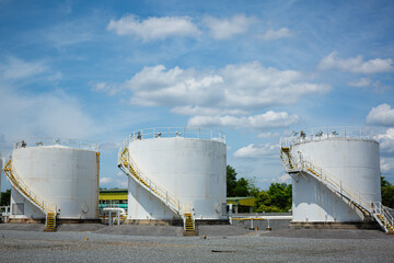 The row of small white tanks for petrol station and refinery
