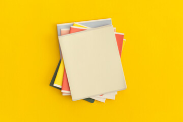 Notebooks on yellow background. Top view. Flat lay. Back to school concept.