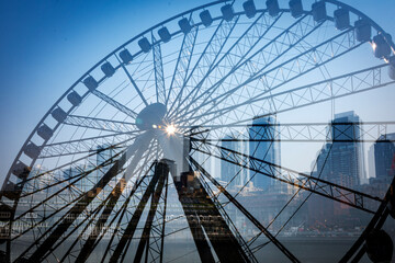 Fototapeta premium double exposure of a ferris wheel and the Seattle skyline