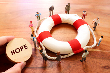 Concept image of life buoy protecting group of people. Rescue and support in times of crisis...