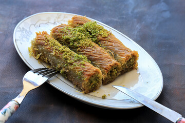 Traditional delicious Turkish food ; pistachio kadayif, Turkish name ; finger twist kadayif