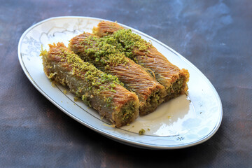 Traditional delicious Turkish food ; pistachio kadayif, Turkish name ; finger twist kadayif