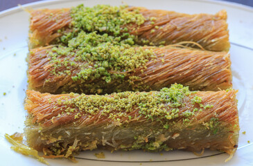 Traditional delicious Turkish food ; pistachio kadayif, Turkish name ; finger twist kadayif
