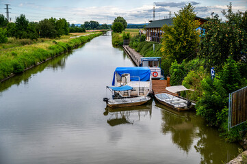 Bata water canal with boat and small pier, Uherske Hradiste.