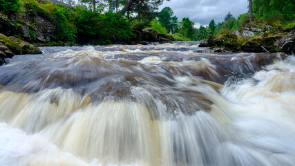 Fototapeta na wymiar The Falls of Dochart at Killin on the River Tay in the Loch Lomond and Trossachs National Park, Scotland