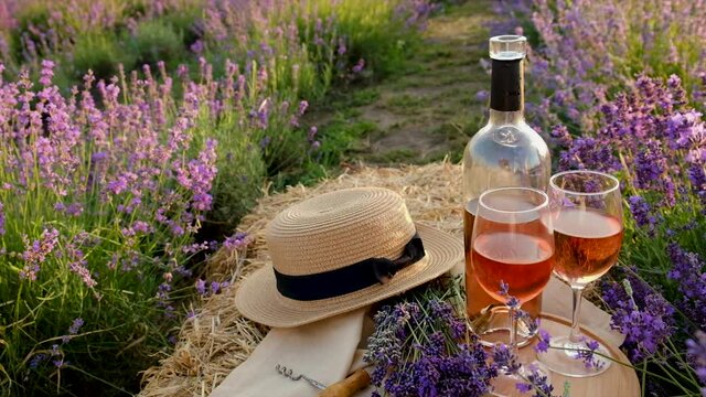 Picnic wine in a lavender field. Selective focus.