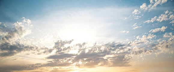 Naklejka na ściany i meble Beautiful sky in the rays of the evening sun. Photographed at sunset.