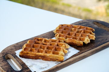 Belgian sugar waffles served on outdoor cafe terrace