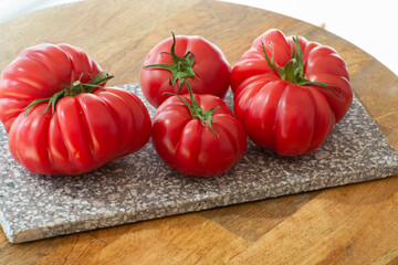 Ripe pink tasty monterosa tomatoes from Spain