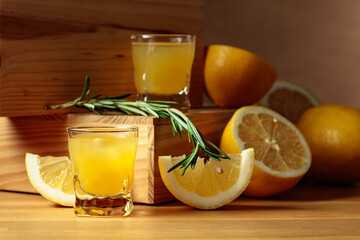 Limoncello on a wooden table.