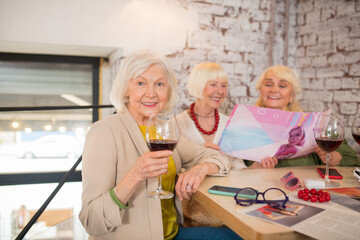 Female company sitting at the table and having a discussion