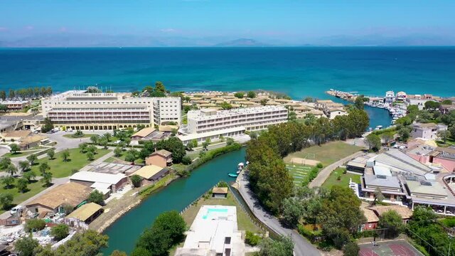Water channel between Moraitika and Messonghi villages, Corfu Island in Greece, view with Messonghi Beach holiday resort on left side, 4k video