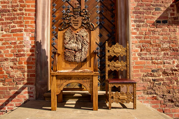 Wood carved majestic royal throne chair. 15 August 2021, Baranovichi, Belarus