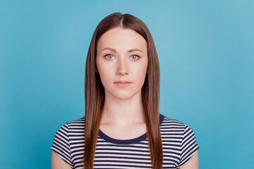 Portrait of charming gorgeous lady look camera on blue background