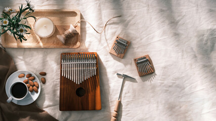 Kalimba or mbira is an African musical instrument.Traditional small Kalimba made from wooden board...