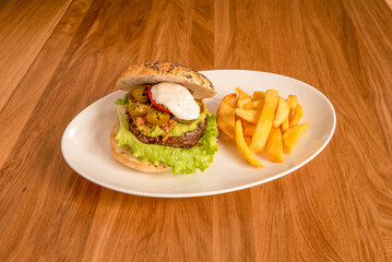 Mexican beef burger with guacamole and frites