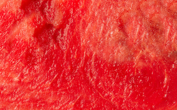 Red watermelon pulp or flesh texture background.