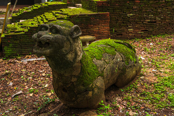 Lion sculpture in Thai Lanna traditional style at Wat Umong Suan Puthatham is a major tourist attraction with green forest nature in Chiang Mai,Thailand.