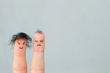 Fingers art of people. One woman is upset because she doesn't have much hair.