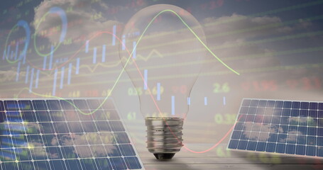 Image of financial data processing over light bulb and solar panels