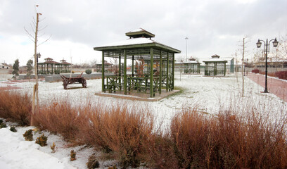 Fototapeta na wymiar gazebos in the public park on a winter day