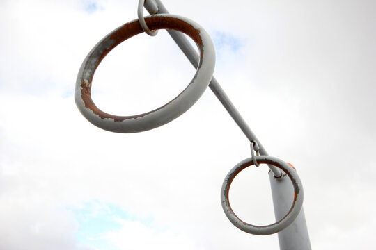 Outdoor metal sports rings. Gymnastics equipment concept