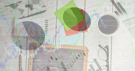 Image of financial data processing over tablet on desk