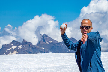 Throwing snowballs in the French Alps during summertime