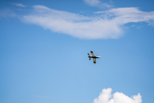 Remote controlled aircraft flying on blue sky