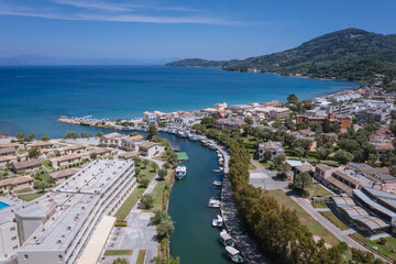 Messonghi Beach holiday resort over canal separating Moraitika and Messonghi villages on a Corfu Island, Greece