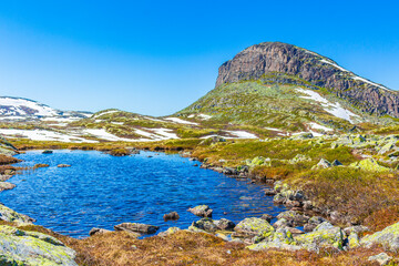 Amazing mountain peak at Veslehødn Veslehorn Hydnefossen waterfall Hemsedal Norway.