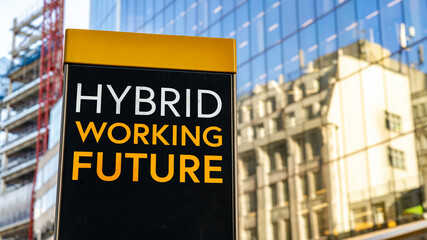Fototapeta premium Hybrid Working Future Worn Sign in business city setting 