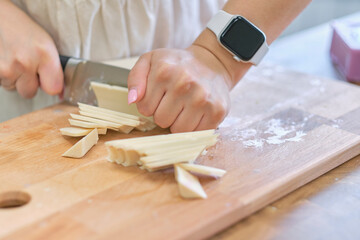 Hand made yellow candles from natural bee wax. The process of creating candles with your own hands. Master class on creating candles at table, closeup