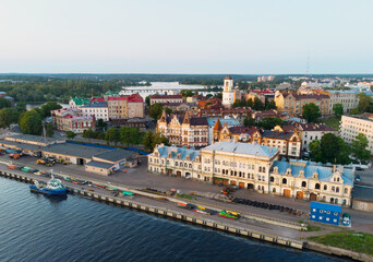 Fototapeta na wymiar Aerial view of Vyborg city and port. Clock tower, houses, castle, ship. Russia