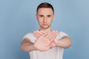 Photo of young handsome man unhappy sad crossed hands no stop sign decline refuse isolated over...
