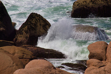 waves crashing on rocks