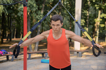 young athletic man goes in for sports in the park. outdoor fitness, healthy lifestyle