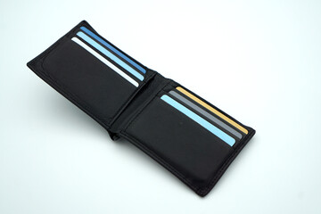 Men's leather wallet with several cards in it on isolated white background 