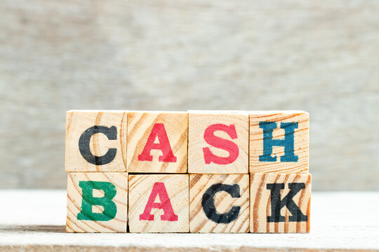 Alphpabet letter block in word cash back on wood background
