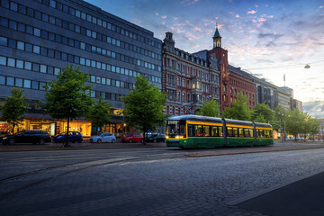 City Tram in Mannerheimintie Street at sunset - Helsinki main street at city centre - Helsinki,...