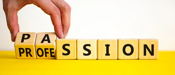 Foto op Plexiglas Passion or profession symbol. Businessman turns wooden cubes and changes the word profession to passion. Beautiful yellow table, white background, copy space. Business, passion or profession concept. © Dzmitry
