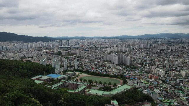 Aerial drone shot flying over Daejeon city in South Korea