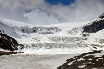 Athabasca Glacier in the Columbia Icefield in Alberta, Canada. The scale can be seen bottom left by trucks and people on the glacier.