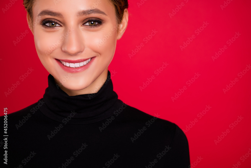 Poster Cropped view portrait of attractive cheerful girl copy blank space advert isolated over vibrant red color background