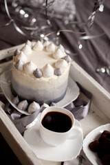 black and white marshmallows cake and black coffee for the holiday