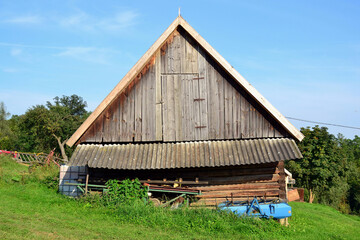 Rural wooden cottage. Summer landscape 